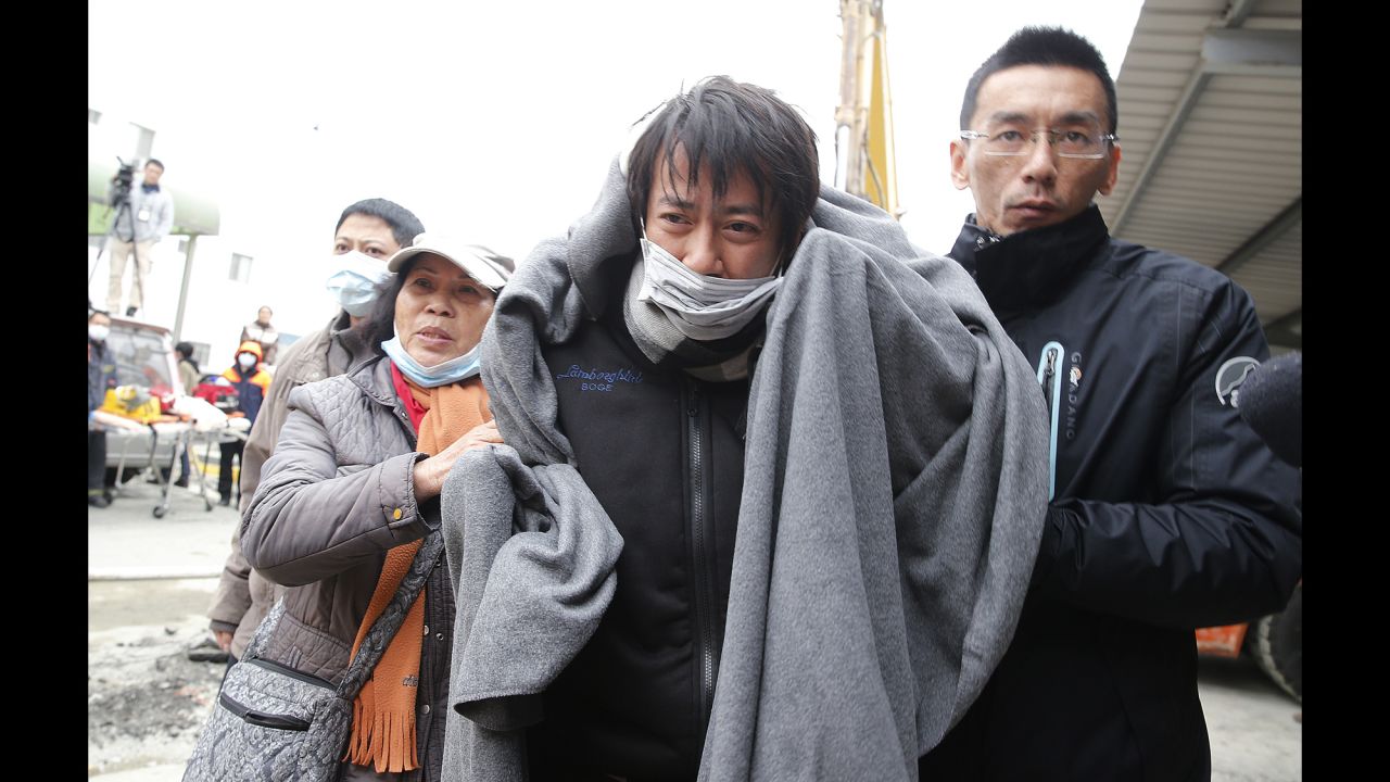 A man is rescued from a collapsed building in Tainan.