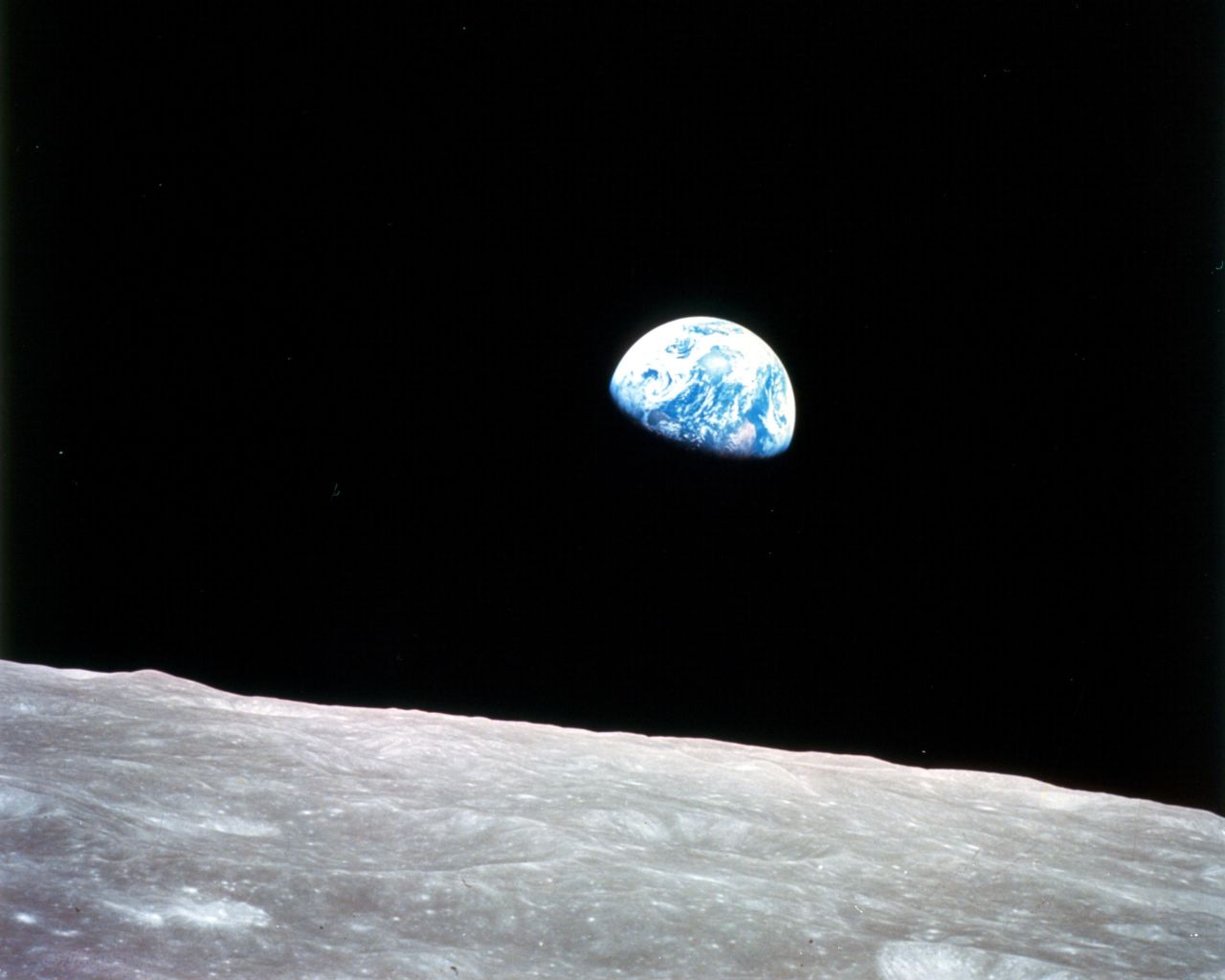 Apollo 8 launched on December 21, 1968, and entered lunar orbit on Christmas Eve. That night, the crew held a live broadcast and showed pictures of the Earth from their spacecraft. "The vast loneliness is awe-inspiring and it makes you realize just what you have back there on Earth," Lovell said. They ended the broadcast taking turns reading from the Book of Genesis.