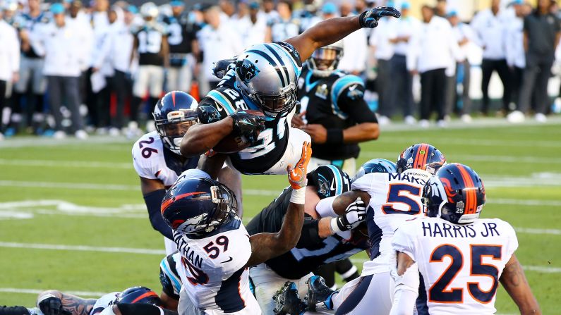 Jonathan Stewart leaps into the end zone, scoring a second-quarter touchdown for the Panthers.