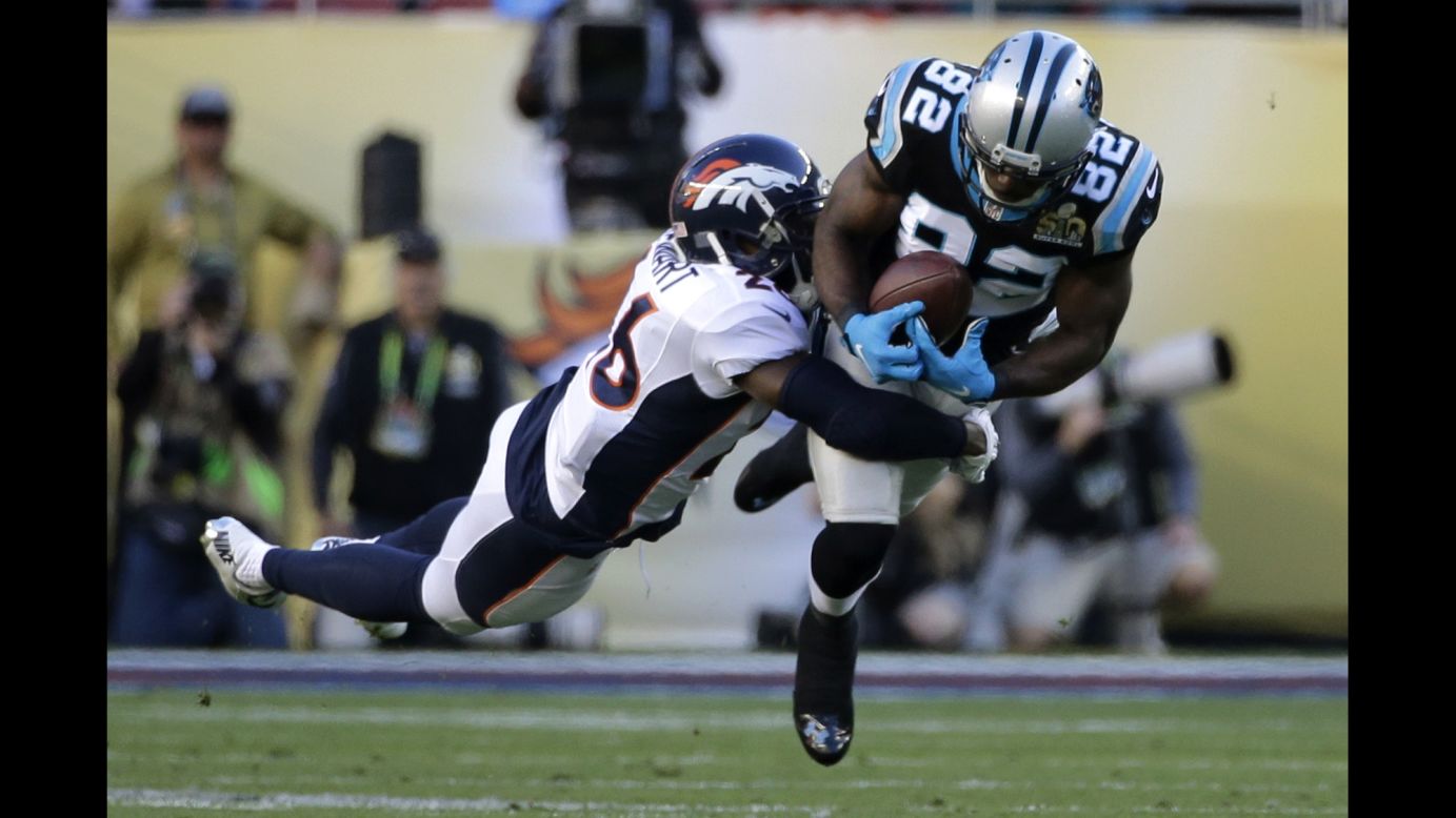 Carolina wide receiver Jerricho Cotchery tries to pull in a pass during the first quarter.