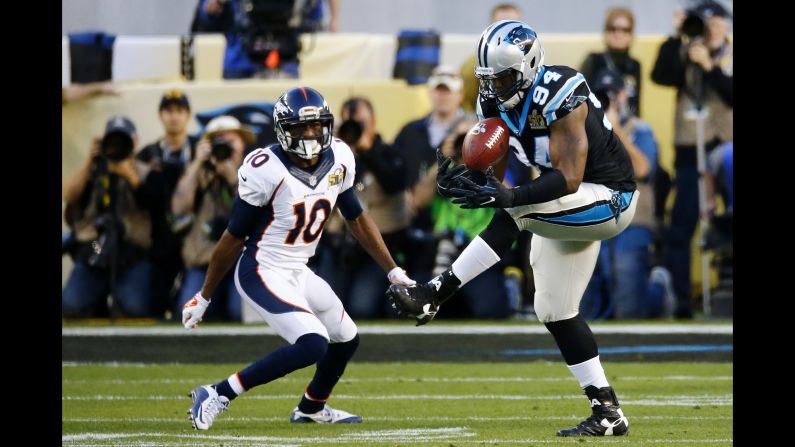 Ealy intercepts a Manning pass intended for Emmanuel Sanders, left.