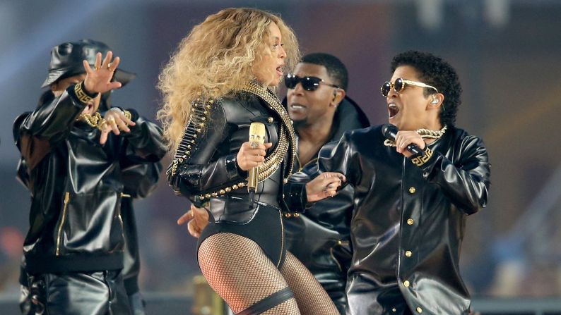 Beyonce takes the stage with Bruno Mars, right.