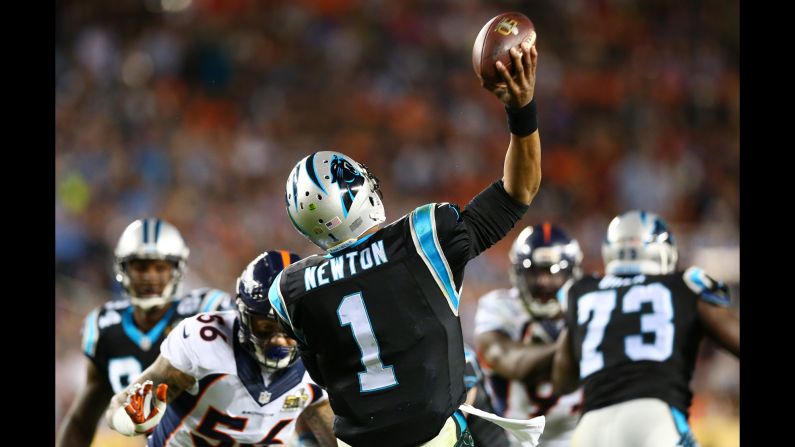 Newton passes the ball in the third quarter.