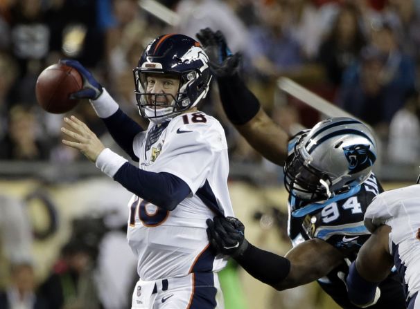 Broncos quarterback Peyton Manning is hit by Carolina's Kony Ealy in the fourth quarter. The hit forced a fumble, and Carolina recovered the ball.