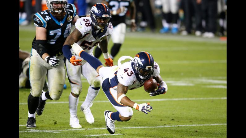 Denver safety T.J. Ward recovers a fumble deep in Carolina territory after teammate Von Miller hit Newton in the fourth quarter. It was one of two fumbles forced by Miller in the game.