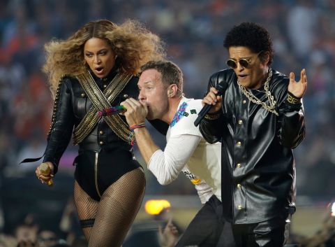 Beyoncé performs with Coldplay's Chris Martin and singer Bruno Mars during the Super Bowl 50 halftime show on February 7, 2016