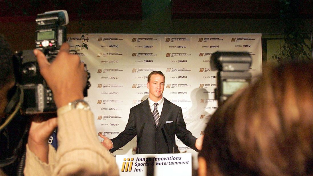 Manning talks to the media after signing a deal with a sports memorabilia company in 2005. Manning's "everyman" persona has also made him a popular pitchman for brands such as Gatorade, Papa John's and Nationwide.