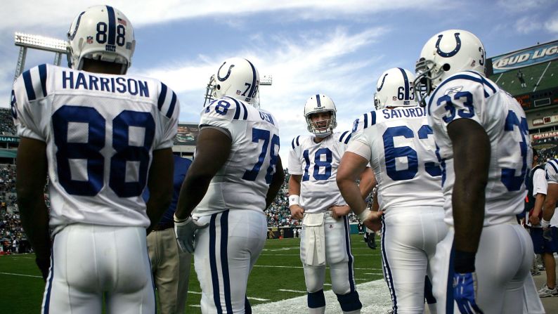 Manning stands on the sidelines with his Colts teammates during a game in 2006.