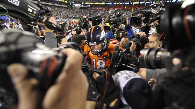 Manning leaves the field after the Broncos were crushed by Seattle in <a href="index.php?page=&url=http%3A%2F%2Fwww.cnn.com%2F2014%2F02%2F02%2Fworldsport%2Fgallery%2Fsuper-bowl-denver-seattle%2Findex.html" target="_blank">Super Bowl XLVIII</a> in 2014.