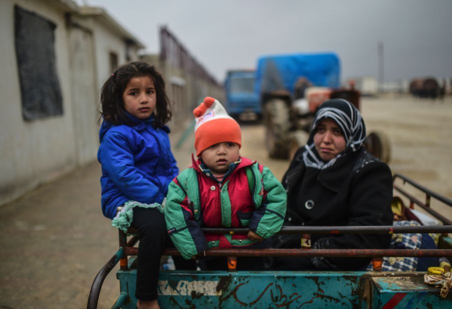 Refugee children arrive at the Turkish border gate on February 6.