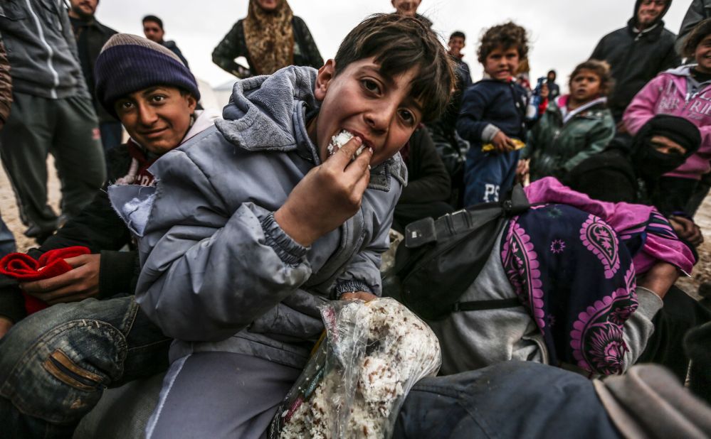 Syrian refugees are pictured in a camp as they flee the city of Aleppo on February 6.