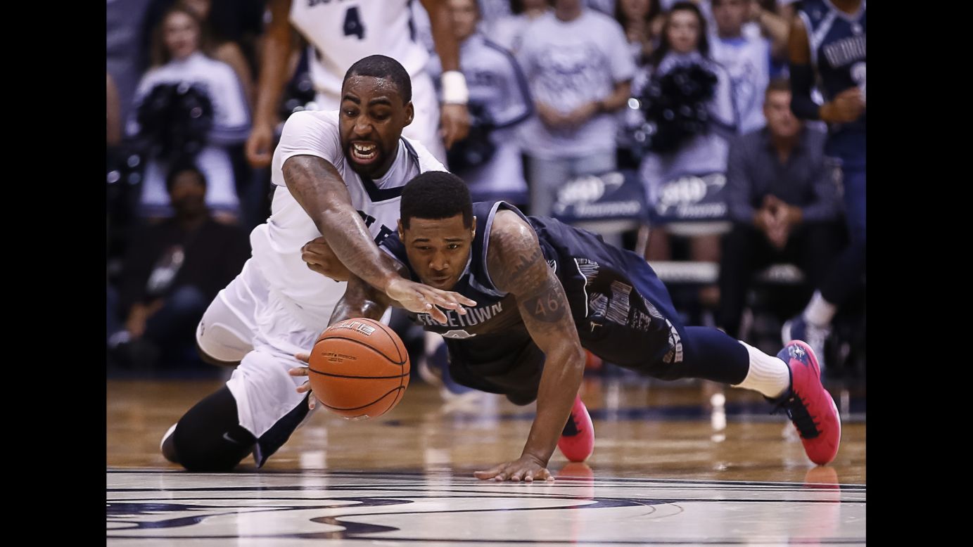 Butler's Roosevelt Jones, left, competes for a loose ball with Georgetown's D'Vauntes Smith-Rivera during a Big East basketball game in Indianapolis on Tuesday, February 2.