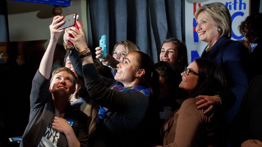 Democratic presidential candidate former Secretary of State Hillary Clinton, poses for selfies with supporters at a debate watching party on February 4,  in Durham, New Hampshire. Clinton is campaigning in the lead up to the The New Hampshire primary, February 9. 