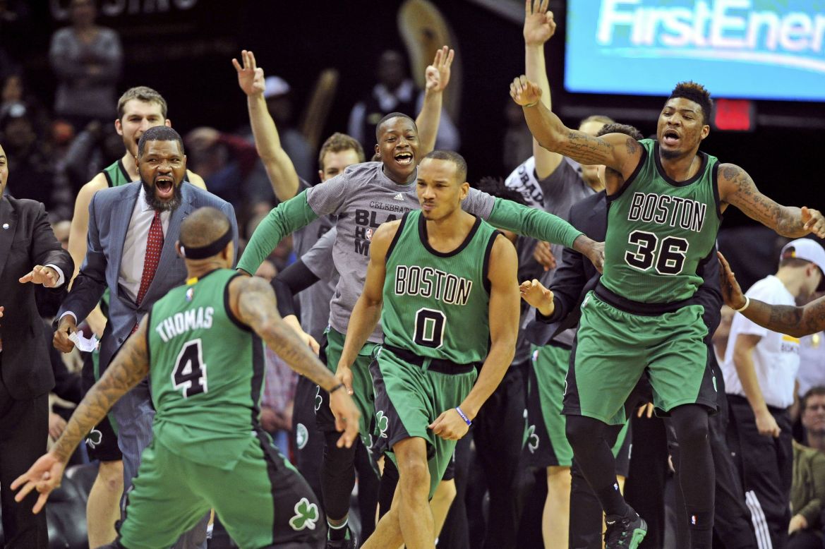 The Boston Celtics celebrate after Avery Bradley (No. 0) hit a buzzer-beating 3-pointer to win in Cleveland on Friday, February 5.