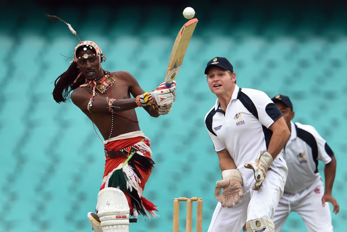 A Maasai warrior from Kenya plays a shot during a cricket match in Sydney on Thursday, February 4. A team of Maasai warriors is touring the world to play cricket and raise awareness of issues such as HIV/AIDS and female genital mutilation.