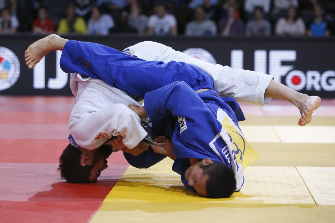 Japan's Hiroyuki Akimoto, right, competes against Georgia's Nugzari Tatalashvili at the Grand Slam judo tournament in Paris on Saturday, February 6. Akimoto won to take home the bronze medal in their weight class.