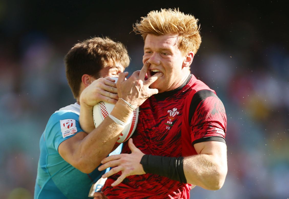 Welsh rugby player Sam Cross is tackled by Russia's German Davydov during the Sydney Sevens tournament on Sunday, February 7.