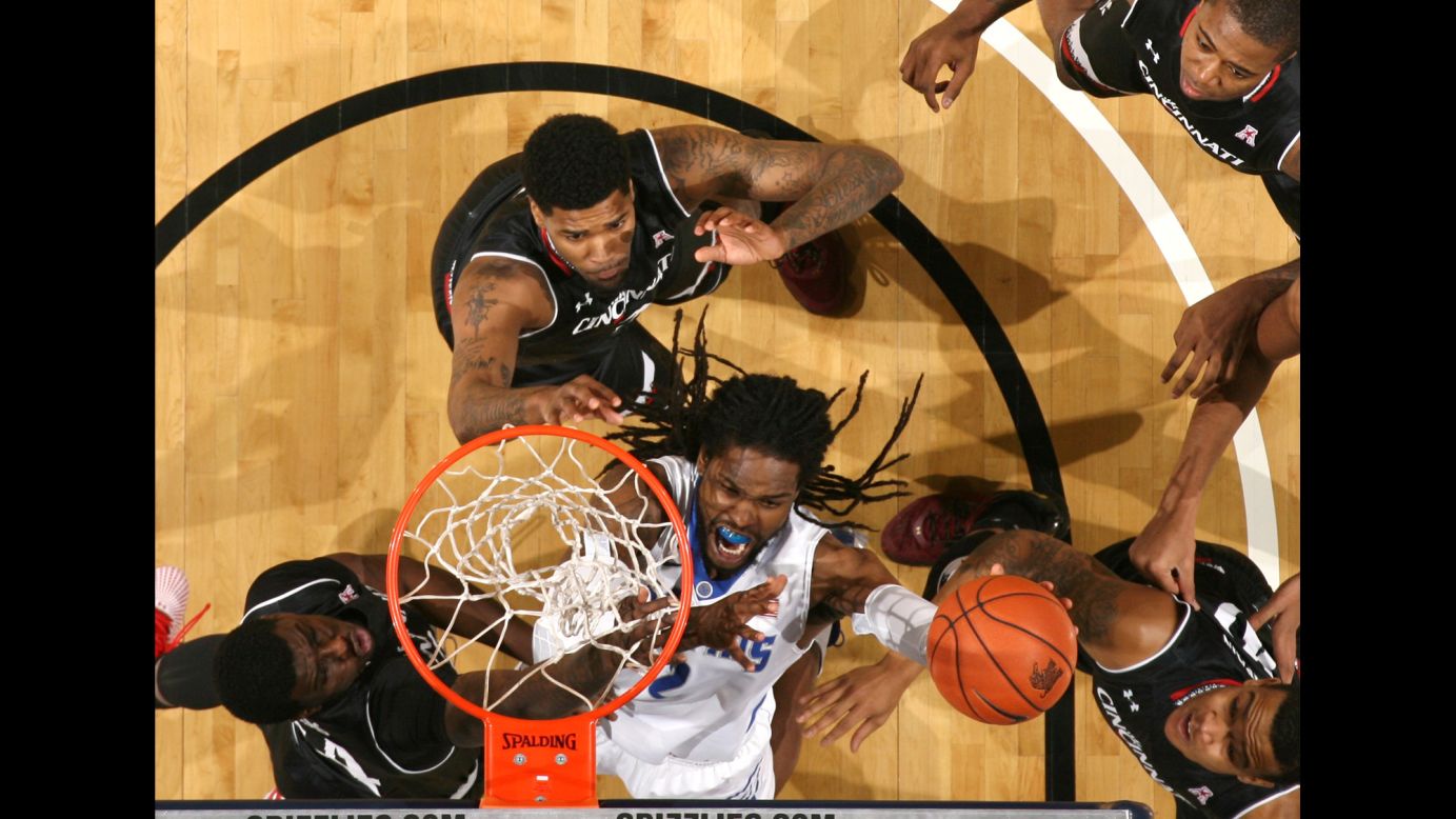 Memphis' Shaq Goodwin is surrounded by Cincinnati defenders as he shoots the ball Saturday, February 6, in Memphis, Tennessee.