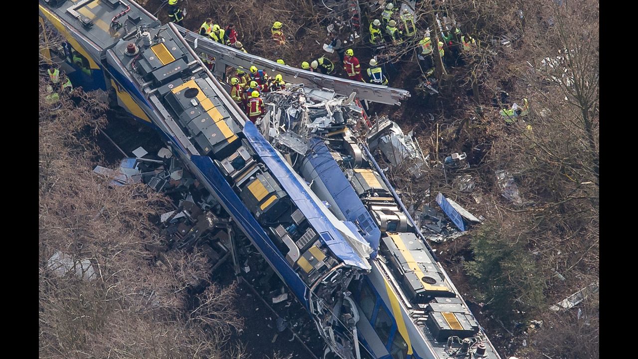Rescue workers search the site of a deadly train accident near Bad Aibling, Germany, on Tuesday, February 9. Two trains collided in the southern state of Bavaria, police said.