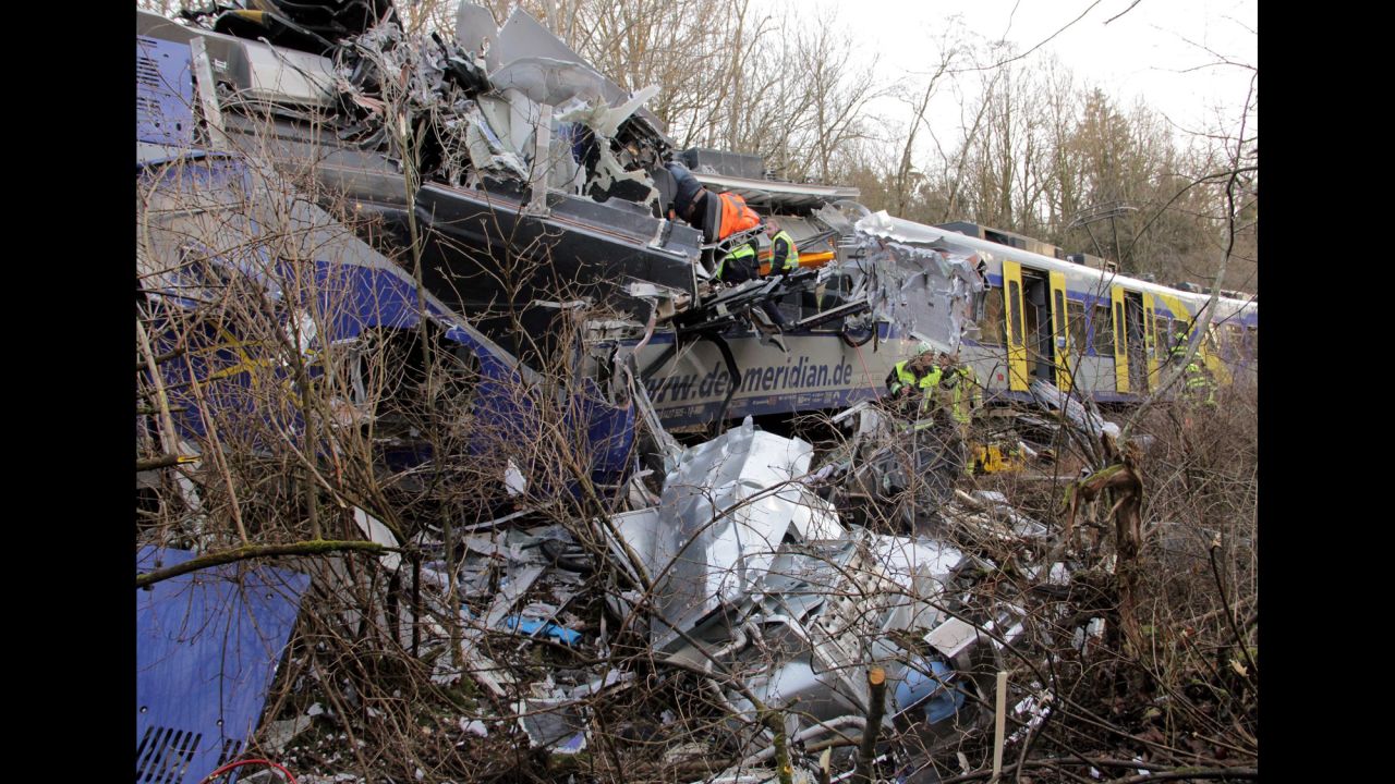 Rescue workers search the site in hopes of freeing people trapped in the wreckage.