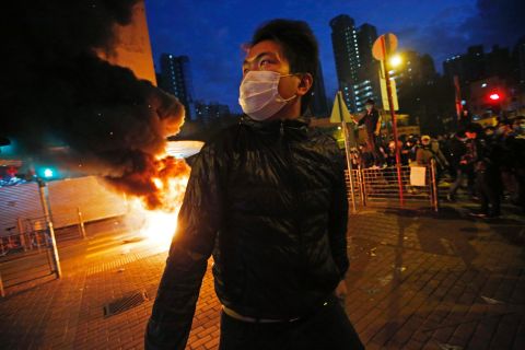 Smoke rises as protesters set fires on a street in Mong Kok in the early hours of February 9.