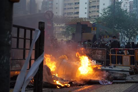 Protesters build fires in the middle of the street in Mong Kok on February 9.
