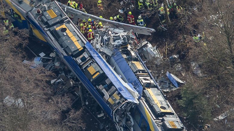 Aerial view shows firefighters and emergency doctors working at the site of a train accident near Bad Aibling, southern Germany, on February 9, 2016. Two Meridian commuter trains operated by Transdev collided head-on near Bad Aibling, around 60 kilometres (40 miles) southeast of Munich, killing at least eight people and injuring around 100, police said. The cause of the accident was not immediately clear. (Photo credit PETER KNEFFEL/AFP/Getty Images)
