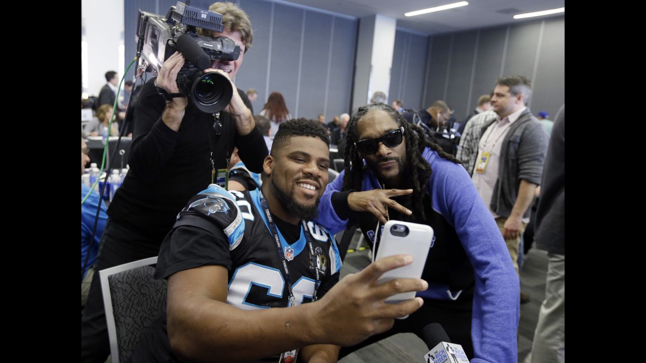 Carolina Panthers defensive tackle Daryl Williams takes a selfie with rapper Snoop Dogg at a Super Bowl press conference in San Jose, California, on Thursday, February 4.