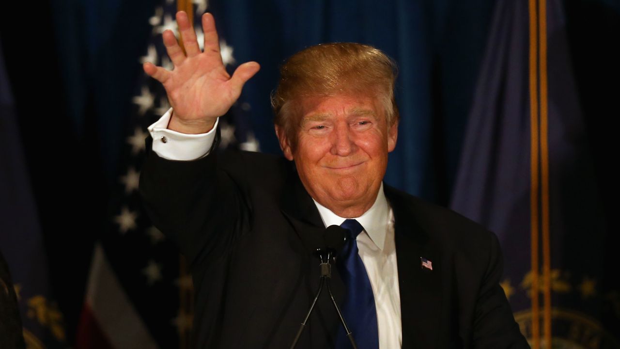 MANCHESTER, NH - FEBRUARY 09:  Republican presidential candidate Donald Trump waves to his supporters after Primary day at his election night watch party at the Executive Court Banquet facility on February 9, 2016 in Manchester, New Hampshire.  (Photo by Joe Raedle/Getty Images)