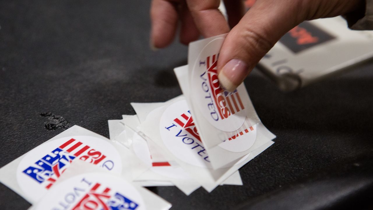 MERRIMACK, NH - FEBRUARY 9: A woman takes an "I Voted" sticker, after voting in the primary election at Merrimack High School on February 9, 2016, in Merrimack, New Hampshire. (Photo by Kayana Szymczak/Getty Images)