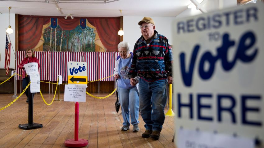 A man and woman leave after casting their ballots, February 9, 2016, in Chichester, New Hampshire.
 / AFP / DOMINICK REUTER        (Photo credit should read DOMINICK REUTER/AFP/Getty Images)