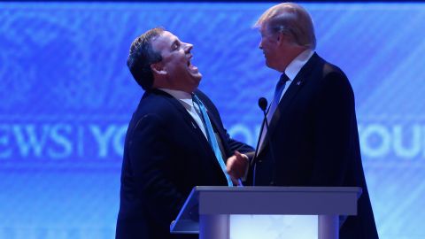 Chris Christie and Donald Trump share a laugh during a commercial break in the Republican presidential debate February 6, 2016, in Manchester, New Hampshire.
