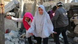 Syrian girls react following a reported Syrian regime air strike in a rebel-controlled area in the northern city of Aleppo on February 8, 2016. 
Regime forces backed by intense Russian air strikes have closed in on Aleppo city in their most significant advance since Moscow intervened in September in support of President Bashar al-Assad's government.

 / AFP / Ameer al-Halbi        (Photo credit should read AMEER AL-HALBI/AFP/Getty Images)