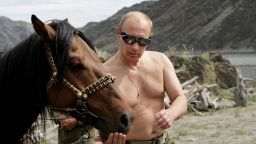 Russian Prime Minister Vladimir Putin is pictured with a horse during his vacation outside the town of Kyzyl in Southern Siberia on August 3, 2009.  AFP PHOTO / RIA-NOVOSTI / ALEXEY DRUZHININ (Photo credit should read ALEXEY DRUZHININ/AFP/Getty Images)