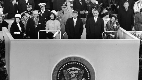 Kennedy and his wife stand at the 1960 inauguration with his parents on the left. Vice President Lyndon B. Johnson and his wife, Lady Bird, are on the right. During his inaugural speech, Kennedy spoke these memorable words: "Ask not what your country can do for you, ask what you can do for your country."