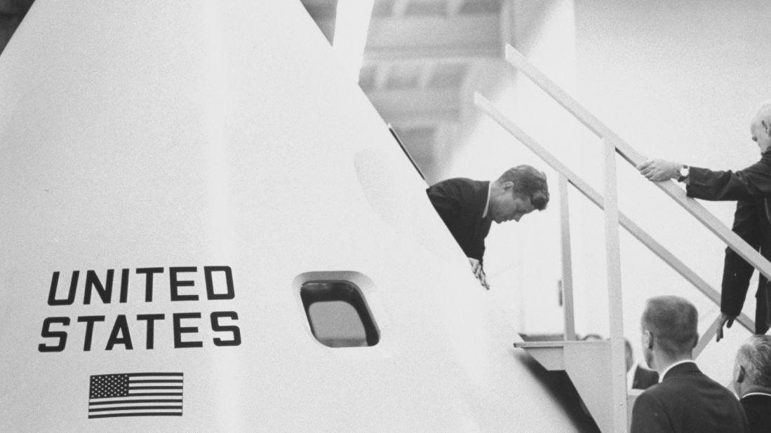 In May 1961, Kennedy urged Congress to send a man to the moon by the end of the decade. Here, he emerges from inside a model of the Apollo space capsule during a tour of the Manned Space Center -- now the Lyndon B. Johnson Space Center -- in Houston.   