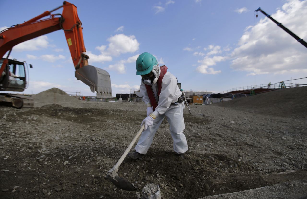 A worker levels out the ground at the Fukushima Daiichi nuclear plant on February 10.