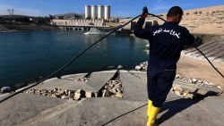 An employee works at strengthening the Mosul Dam on the Tigris River, around 50 kilometres north of the Iraqi city of Mosul, on February 1, 2016.
The United States is monitoring Iraq's largest dam for signs of further deterioration that could point to an impending catastrophic collapse, US army officers said on January 28, 2016.
The Islamic State (IS) jihadist group seized the Mosul Dam briefly in 2014, leading to a lapse in maintenance that weakened an already flawed structure, and Baghdad is seeking a company to make repairs. / AFP / SAFIN HAMED        (Photo credit should read SAFIN HAMED/AFP/Getty Images)