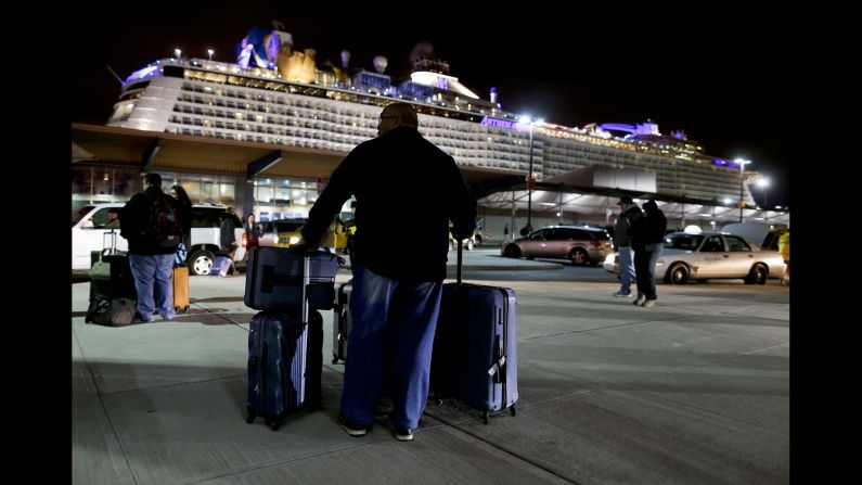 A passenger of Anthem of the Seas, a Royal Caribbean cruise ship, waits for a ride after the boat docked in Bayonne, New Jersey, on Wednesday, February 10. The cruise <a href="http://www.cnn.com/2016/02/10/us/new-jersey-anthem-of-seas-cruise-ship-extreme-storm/" target="_blank">ended early</a> after the ship sailed into a rough storm in the Atlantic, and Royal Caribbean apologized to passengers. "If we knew that we were going to have those kinds of winds, the winds that we actually experienced with the ship, we would not have sailed into that," Bill Baumgartner, the company's senior vice president of global marine operations, told CNN.