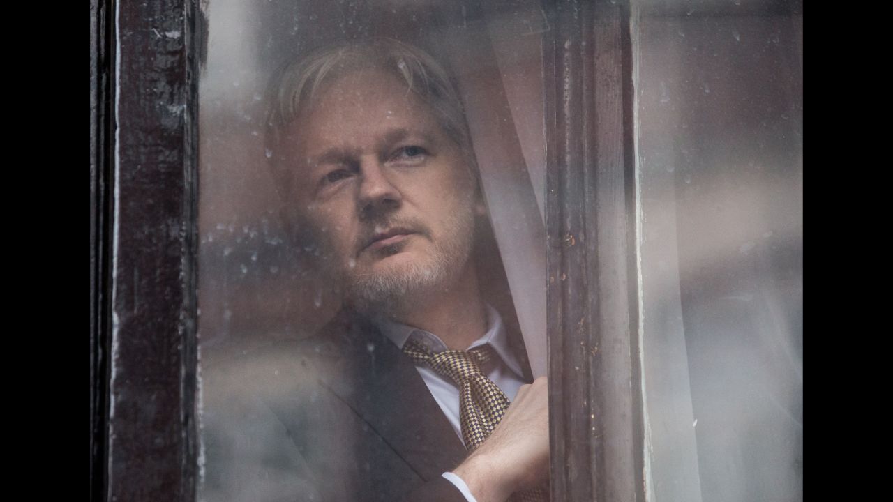 WikiLeaks founder Julian Assange looks out of a door at the Ecuadorian Embassy in London on Friday, February 5. Assange expressed vindication over <a href="http://www.cnn.com/2016/02/05/europe/julian-assange-ruling/index.html" target="_blank">a U.N. panel's judgment </a>that the Swedish and UK governments have "arbitrarily detained" him since 2010.