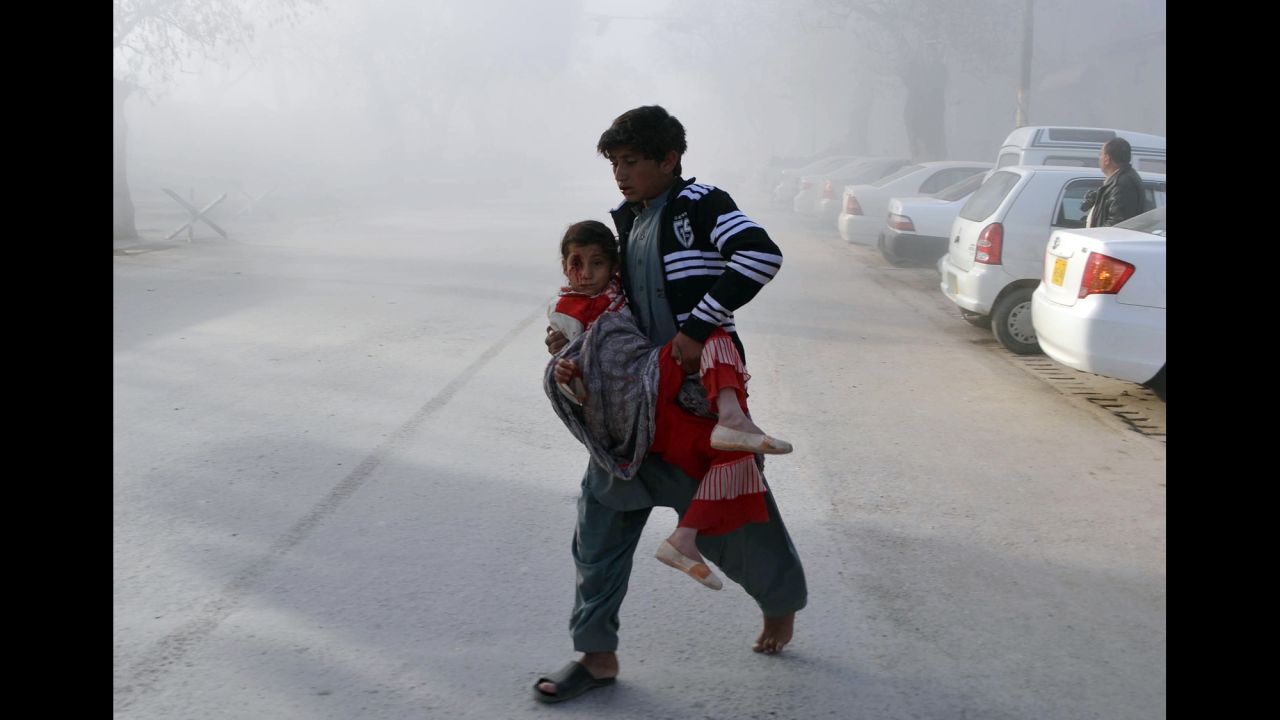 A boy carries an injured girl from the site of a bombing in Quetta, Pakistan, on Saturday, February 6. A man rammed his explosive-laden motorcycle into a Pakistani security force vehicle, <a href="http://www.cnn.com/2016/02/06/asia/pakistan-suicide-attack/" target="_blank">setting off a blast</a> that killed at least eight people and injured about 20 others, officials said. The Pakistani Taliban claimed responsibility for the attack.