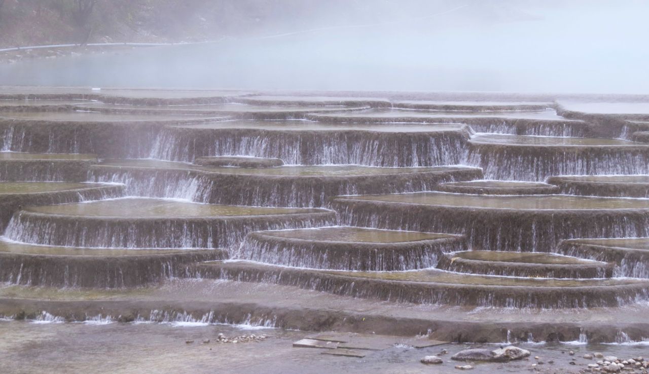 The White Water Terraces are situated at the foothills of Haba Xueshan, a mountain on the northwestern side of Tiger Leaping Gorge.