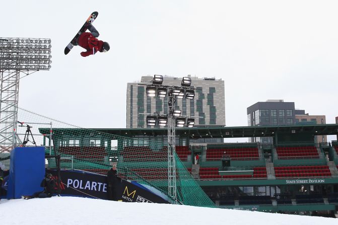 Snowboarder Angus Waddington of Australia competes in the second heat during day one of Big Air at Fenway.