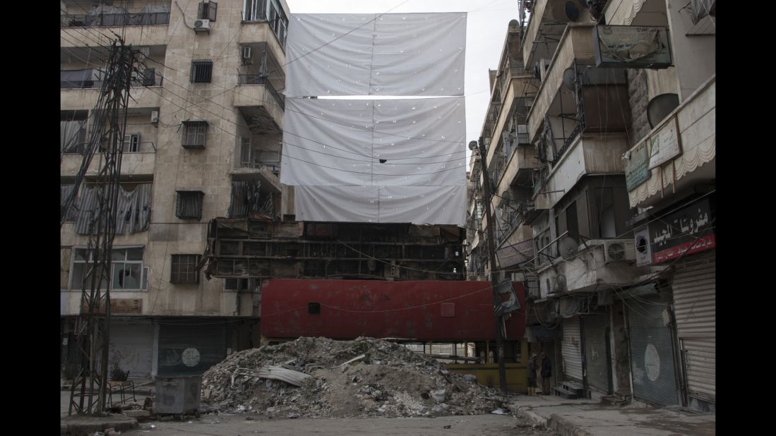 Buses piled one on top of the other offer some protection from enemy fire.