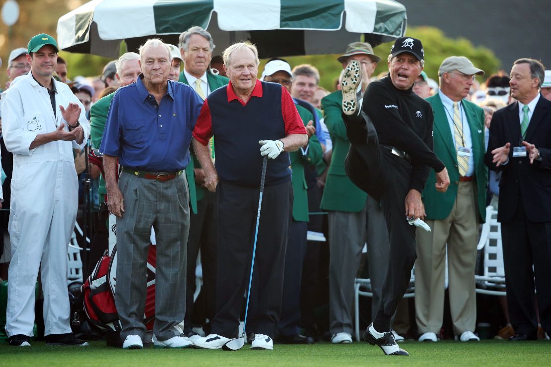 Player (right) demonstrates his agility with Arnold Palmer and Jack Nicklaus at Augusta in 2015