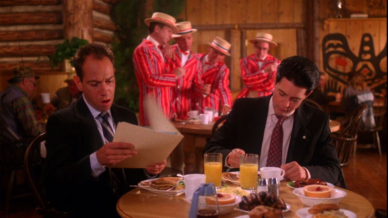 A barbershop quartet creates a surreal scene in a 1990 episode of "Twin Peaks," humming softly in the background while FBI Agent Dale Cooper (Kyle MacLachlan) discusses zen and the art of solving murder mysteries over breakfast with a colleague (Miguel Ferrer). 