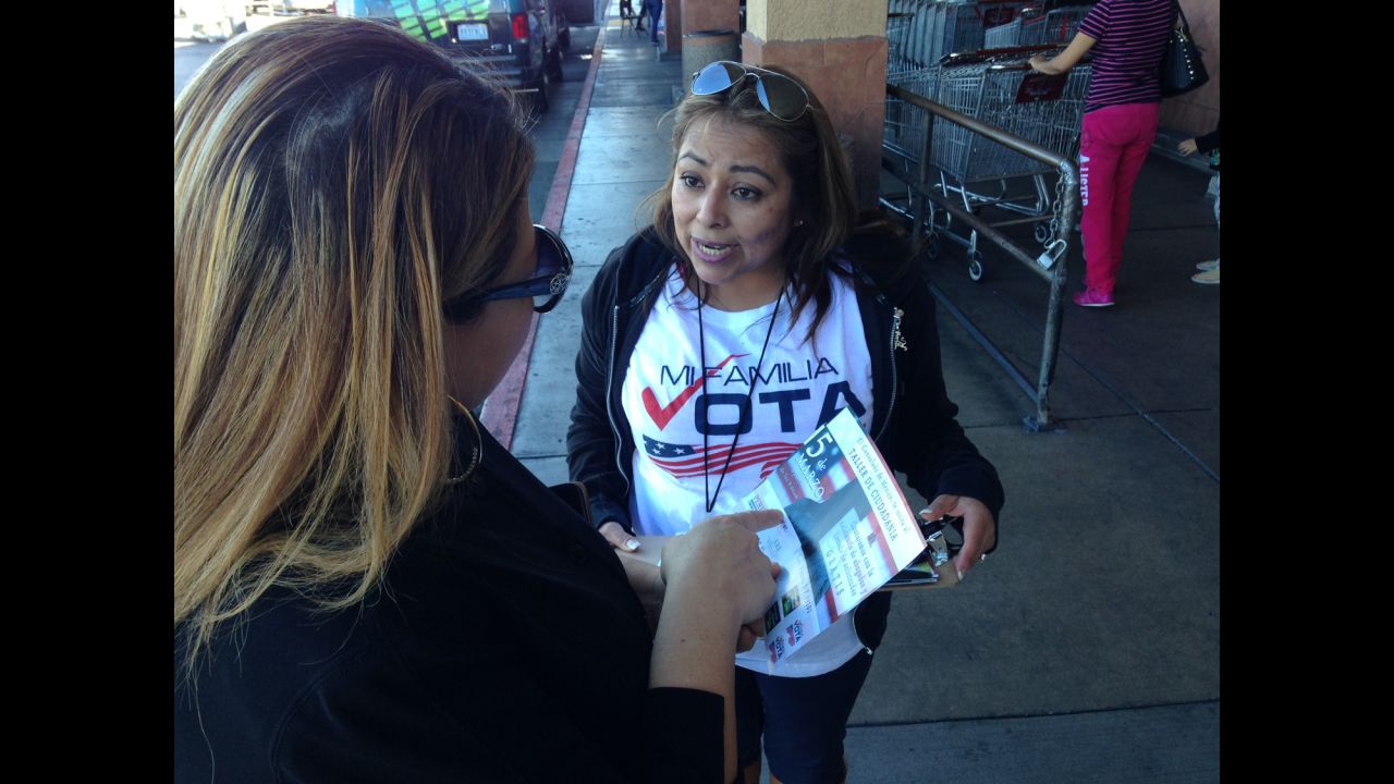 The nonpartisan organization Mi Familia Vota campaigns outside supermarkets in Las Vegas in a drive to register more Latinos to vote.