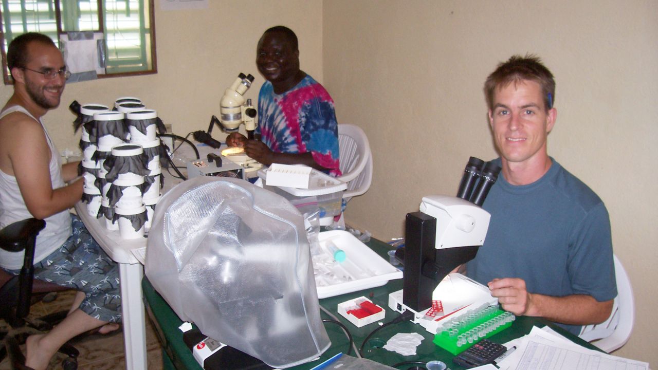 From left: Kobylinski, Sylla and Foy dissect dead mosquitoes in their makeshift Senegal lab. 