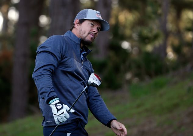 Actor and star of films such as "Ted" and "The Departed," Mark Wahlberg, urges on a tee-shot at Pebble Beach.