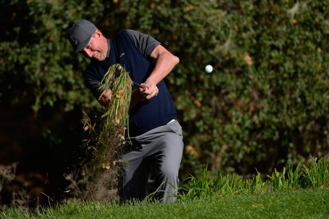 This man is usually quite useful with a stick in his hand. Canadian ice-hockey legend Wayne Gretzky takes a chunk of the rough at the 16th hole at the Spyglass Hill course during the Pebble Beach National Pro-Am.
